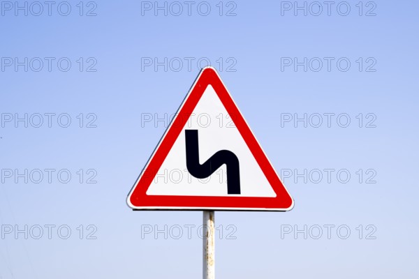 Road sign dangerous turn. Krasnodar, Russia