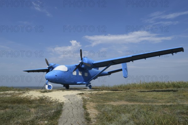 Blue rotary-wing aircraft on the hill. Taman, Krasnodar Krai, Russia