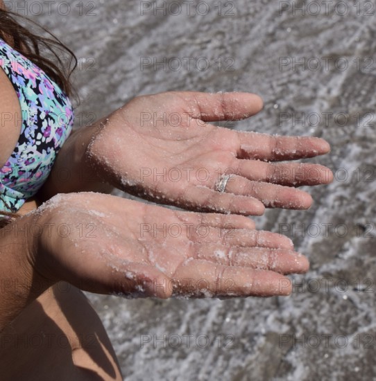Salt on the girl's hands. Taman, Krasnodar Krai, Russia