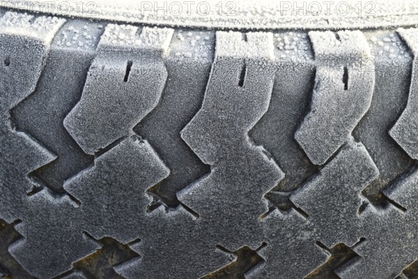 Hoarfrost on a rubber tire wheel. Krasnodar, Russia