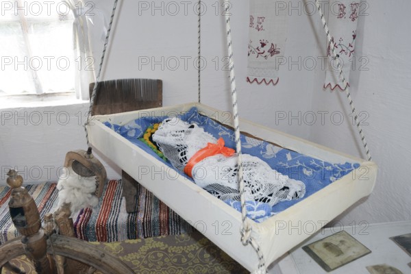 Cradle with dolls in the bedroom. Taman, Krasnodar Krai, Russia
