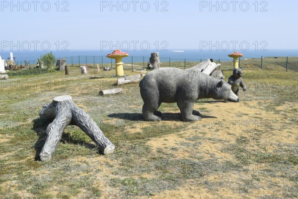 Mannequin dummy bear on the lawn. Taman, Krasnodar Krai, Russia