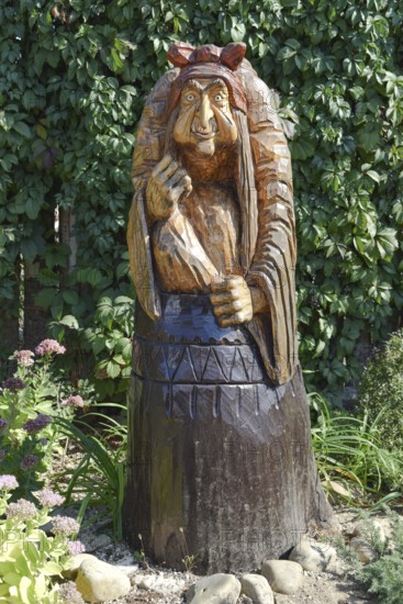 The wooden statue of Baba Yaga in a mortar. Taman, Krasnodar Krai, Russia