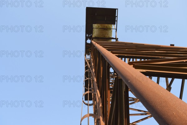 The old rusty water tower tilted. Atyrau, Kazakhstan