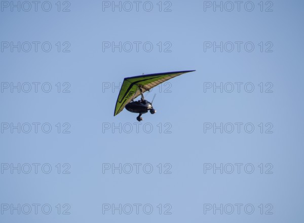 Trike, flying in the sky with two people. Extreme Entertainment travelers. Golubitskaya, Russia
