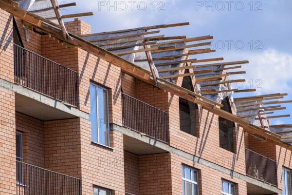 A three-storey brick apartment building under construction. Atyrau, Kazakhstan