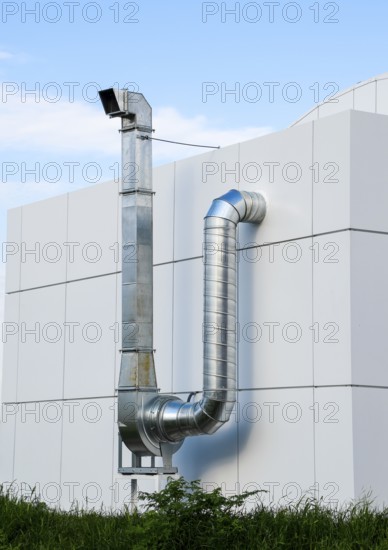 Ventilation hood with a pipe behind the cafe building. Atyrau, Kazakhstan