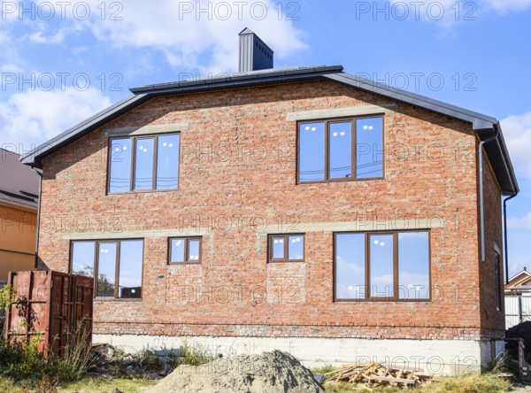 Two-storey house made of red brick. Atyrau, Kazakhstan