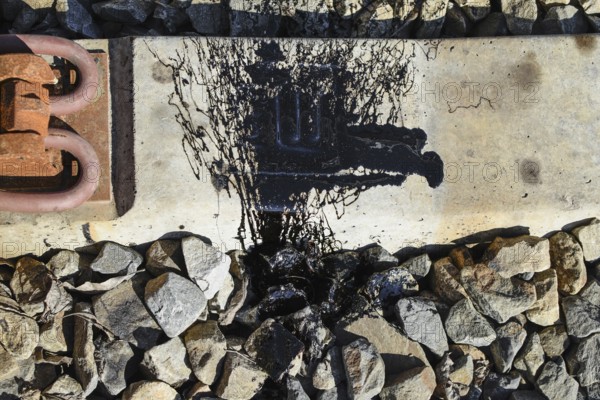 Black Resin shed on the railroad ties. Atyrau, Kazakhstan