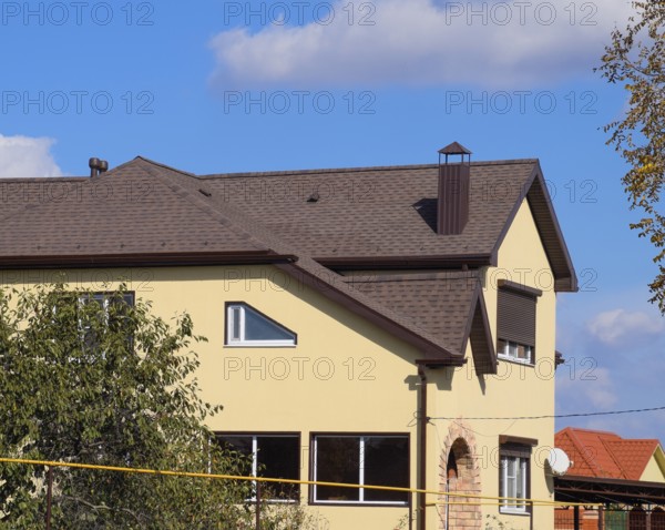 Decorative metal tile on a roof. Atyrau, Kazakhstan