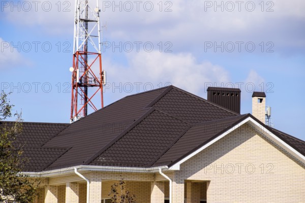 Decorative metal tile on a roof. Atyrau, Kazakhstan