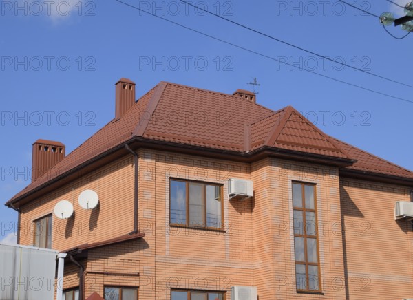 Decorative metal tile on a roof. Atyrau, Kazakhstan