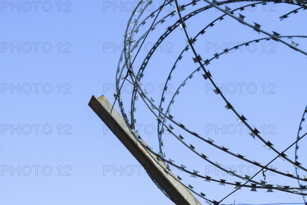 Barbed wire on the fence. Atyrau, Kazakhstan