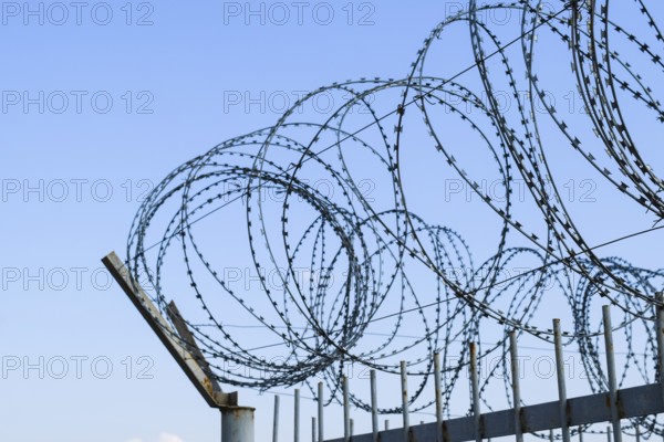 Barbed wire on the fence. Atyrau, Kazakhstan