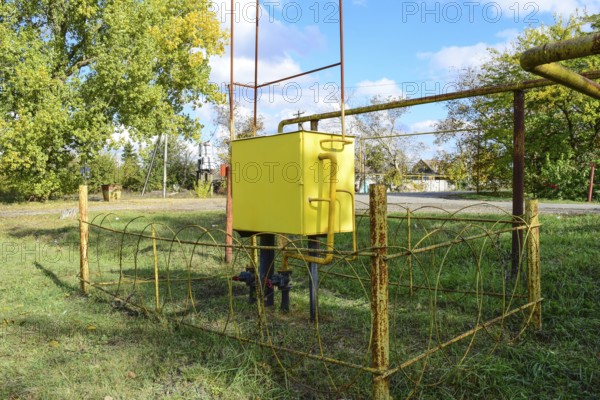 Yellow small gas distribution and regulating natural gas supply station. Atyrau, Kazakhstan