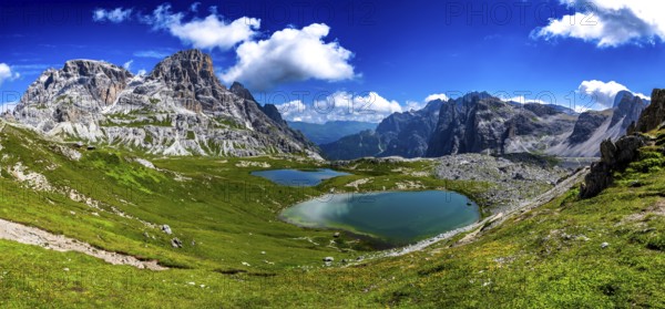 Alpine Landscape With Mountain Peaks And Clear Lakes At The Formation Tre Cime Di Lavaredo In The Dolomites Of South Tyrol In Italy
