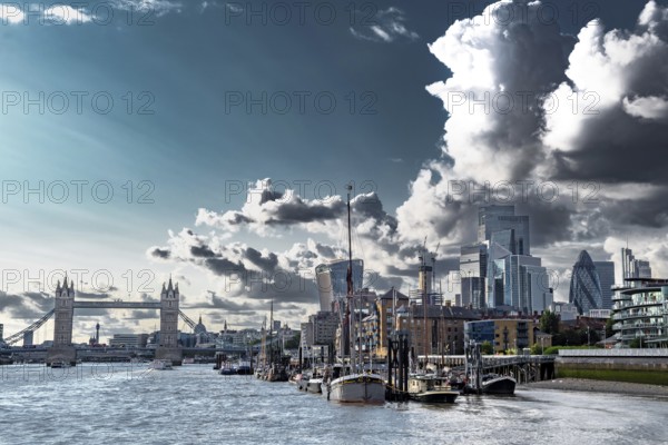 Tower Bridge And River Thames With Ships And Boats In Front Of Modern Office Buildings In The City Of London, United Kingdom