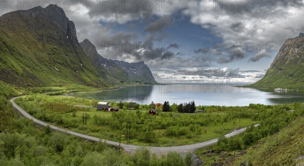 View Over Fjord With Cottages And Mountains From Bergsbotn Viewing Platform On Senja Island In Norway