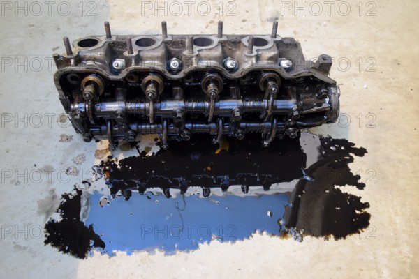 The head of the block of cylinders removed from the engine for repair. Atyrau, Kazakhstan