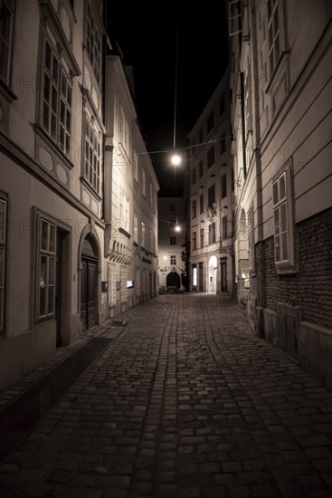 Narrow Alley With Streetlights And Cobblestones In The Inner City Of Vienna In Austria