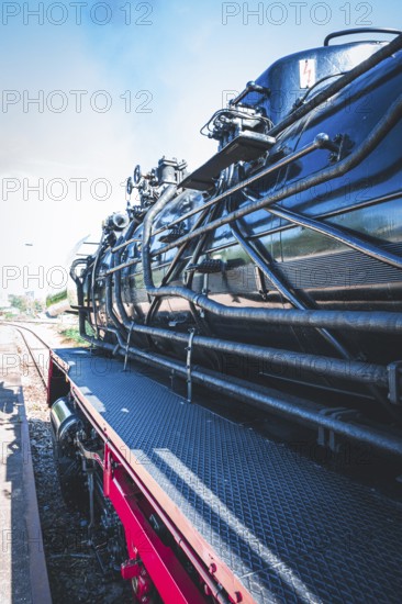 Detailed view of a black steam locomotive with focus on its mechanical parts and texture, Gera, Thuringia, Germany