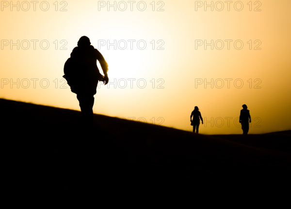Nomads walking in Sahara desert. Egypt