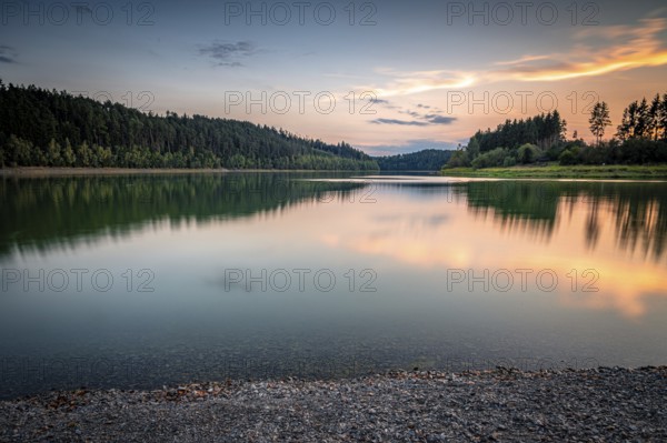 Calm reservoir with evening reflection of the forest and gentle light mood, Zeulenrodaer Meer reservoir, Zeulenroda-Triebes, Thuringia, Germany