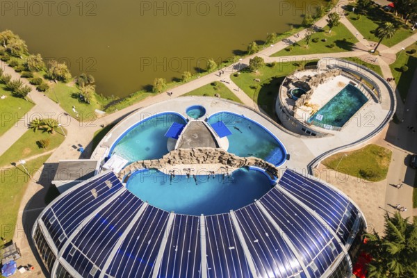 Batumi, Georgia - 7th august, 2025: Aerial view Batumi Georgia dolphinarium with pools beside Nurigeli lake and modern skyline in summer day