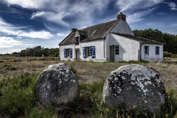Ancient Stone Field Alignements De Menhir Carnac With Neolithic Megaliths And Old Cottage In Brittany, France