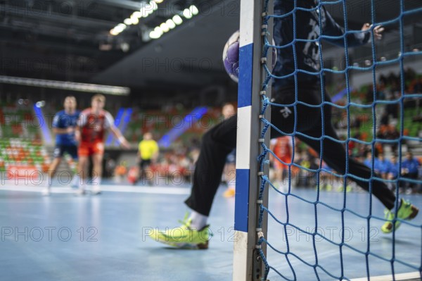 Detail of handball goal post when the ball hits it. Handball match in the background. handball. Lubin, Poland