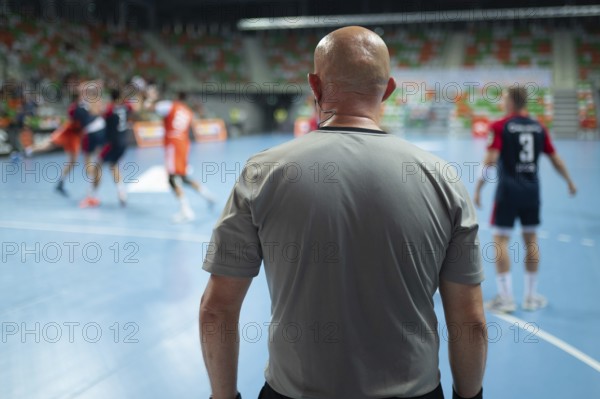 Referee's back during handball match. Lubin, Poland