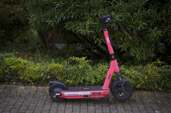 On the side of the road, pavement, parked e-scooter, electric scooter, scooter, in the VOI bike hire shop, pink, Stuttgart, Baden-Württemberg, Germany