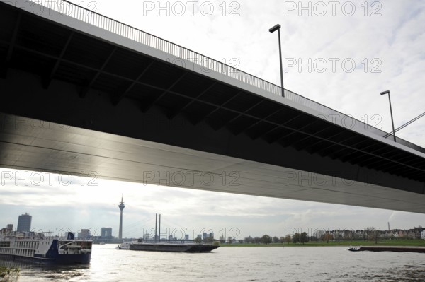 Oberkassel Bridge and ships on the Rhine, on the banks of the Tonhalle, Düsseldorf, Rhineland, North Rhine-Westphalia, North Rhine-Westphalia, Germany