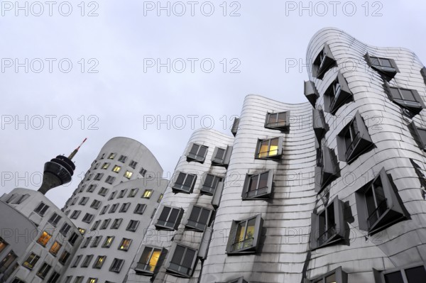 Rhine Tower and Neuer Zollhof, Gehry buildings, modern architecture at the commercial harbour, Media Harbour, Düsseldorf, Rhineland, North Rhine-Westphalia, North Rhine-Westphalia, Germany