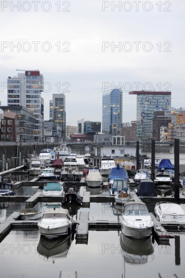 Boats in the customs harbour, modern architecture at the Media Harbour, Düsseldorf, Rhineland, North Rhine-Westphalia, North Rhine-Westphalia, Germany