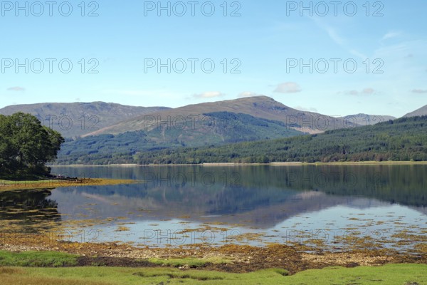 Calm lake with reflections of the surrounding mountains and blue sky, Scotland, Great Britain, Loch Eil, Scotland, Great Britain