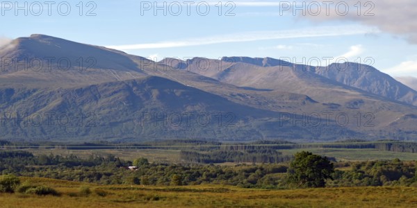 Vast mountain landscape with wooded hills and clear skies, Highlands, Ben Nevis, Scotland, Great Britain