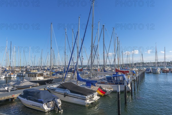 Strande marina near Kiel, Rendsburg-Eckernförde district, ship masts, jetty, dolphins, Baltic Sea, sailing, leisure activities, water sports, flag, summer, blue sky, sunshine, Bay of Kiel, Schleswig-Holstein, Germany