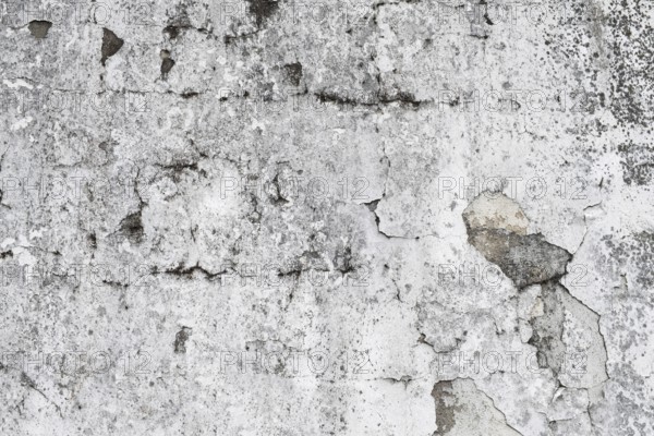 Weathered grey wall with cracks and visible texture, Hesse, Germany