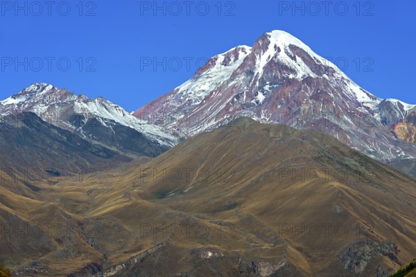 The snow and ice-covered peak of Kazbek, Stepantsminda, Georgia