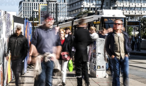 A long exposure shows people at a tram stop at Alexanderplatz, Berlin, 27/09/2025, Berlin, Berlin, Germany