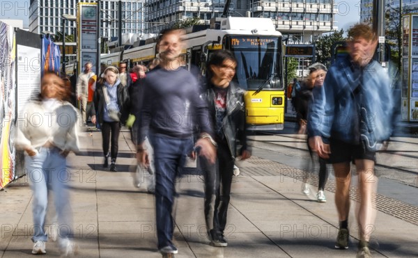 A long exposure shows people at a tram stop at Alexanderplatz, Berlin, 27/09/2025, Berlin, Berlin, Germany