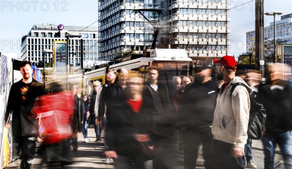 A long exposure shows people at a tram stop at Alexanderplatz, Berlin, 27/09/2025, Berlin, Berlin, Germany