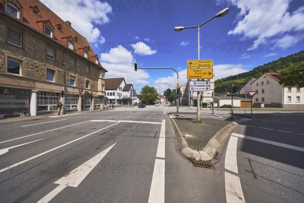 Traffic light crossing, general architecture, signposts to Darmstadt, Bensheim, Erbach, Fürth, Grasellenbach as well as to the old town and city centre, lantern, direction arrows, stop line, lanes, road markings, blue sky, cumulus clouds, intersection Darmstädter Straße with Friedrich-Ebert-Straße and Lehrstraße, federal roads B460 and B3, Heppenheim, Odenwald, Bergstraße district, Hesse, Germany