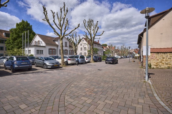 Multi-family houses, general architecture, lantern, parking boxes, cars, bare winter trees, blue sky, cumulus clouds, intersection Graben with Kellereigasse, Heppenheim, Odenwald, Bergstraße district, Hesse, Germany