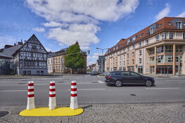 Half-timbered house, general architecture, traffic light crossing, bollards, pavement made of cobblestones, car, trees, blue sky, cumulus clouds, intersection Lorscher Straße, Darmstädter Straße, Friedrichstraße with Ludwigstraße, federal roads B460 and B3, Heppenheim, Odenwald, Bergstraße district, Hesse, Germany