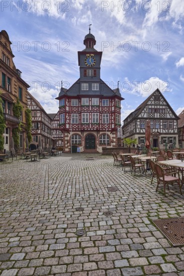 Historic town hall, old town, square, half-timbered houses, tower clock, cobblestone pavement, outdoor area of a restaurant, backlight, blue sky, cumulus clouds, cirrostratus clouds, Großer Markt, market square, Heppenheim, Odenwald, Bergstrasse district, Hesse, Germany
