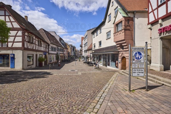 Access to pedestrian zone with traffic sign, half-timbered houses, general architecture, city centre, retail, retail shops, shopping, outdoor area of a restaurant, pavement made of cobblestones, blue sky, cumulus clouds, Friedrichstraße, Heppenheim, Odenwald, Bergstraße district, Hesse, Germany