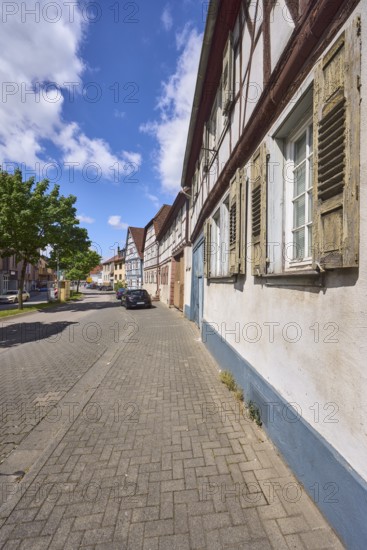 Half-timbered houses, general architecture, street, car park with vehicles, facade with windows and shutters, pavement, trees, blue sky, cumulus clouds, federal road B460, Lehrstraße, Heppenheim, Odenwald, Bergstraße district, Hesse, Germany
