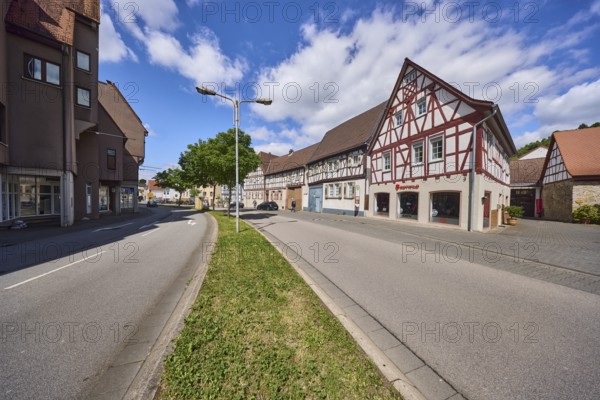 Half-timbered houses, general architecture, lantern, central reservation, trees, lawn, lanes, blue sky, cumulus clouds, Lehrstraße, federal road B460, Heppenheim, Odenwald, Bergstraße district, Hesse, Germany